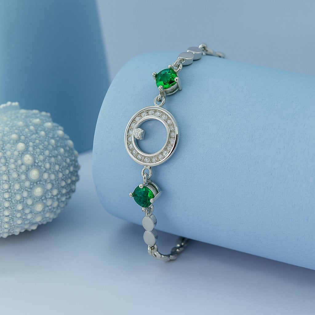 Elegant Silver Bracelet with Green Stones & Circular Crystal Centerpiece