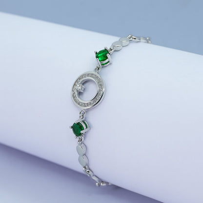Elegant Silver Bracelet with Green Stones & Circular Crystal Centerpiece