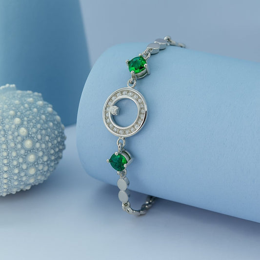 Elegant Silver Bracelet with Green Stones & Circular Crystal Centerpiece